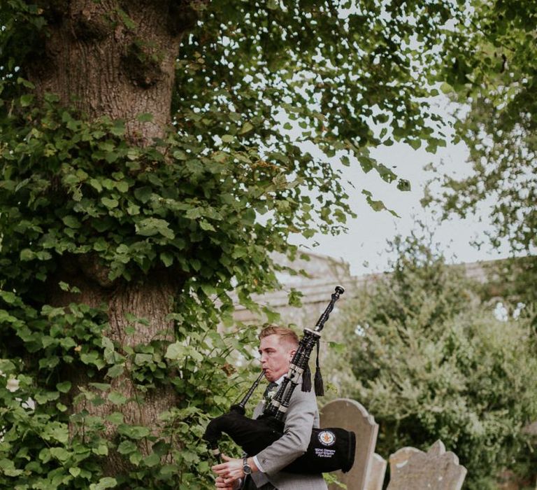 Bagpipes play for Scottish wedding in Sussex