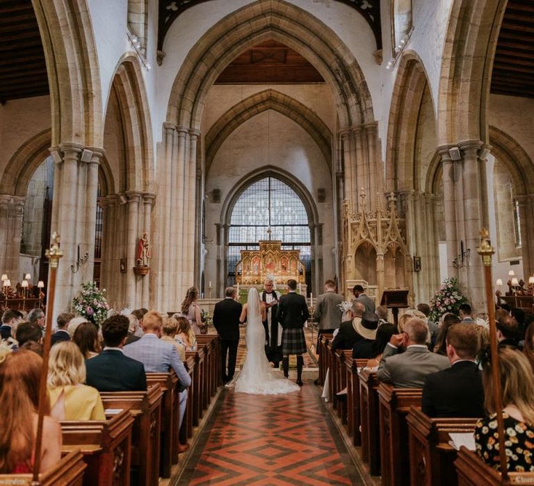 Bride and groom at altar in church ceremony