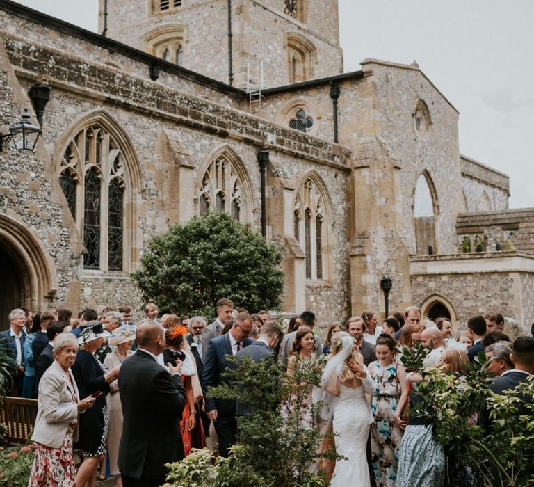 Wedding guests outside church