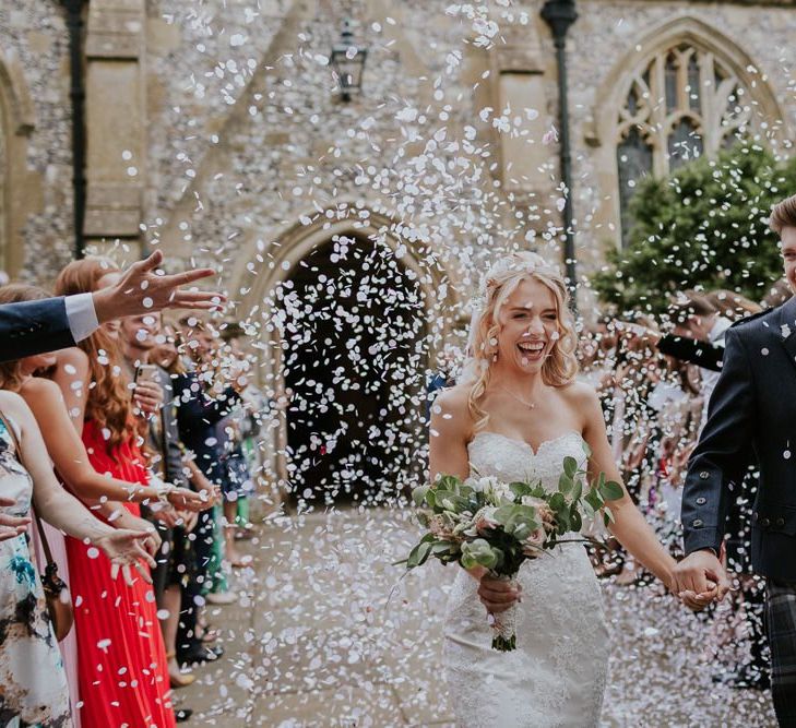 Bride and groom confetti exit