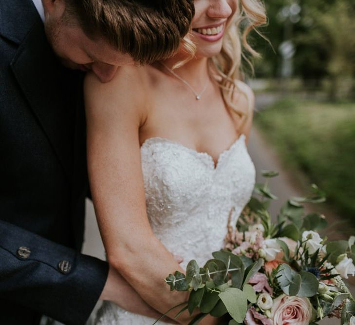 Bride and groom steal a moment after church wedding ceremony