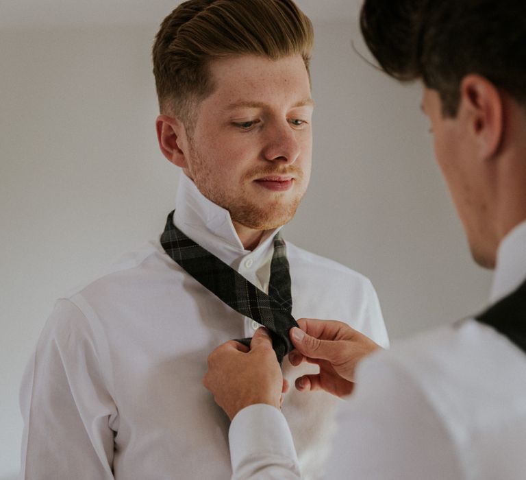 Groom preparations for Sussex wedding