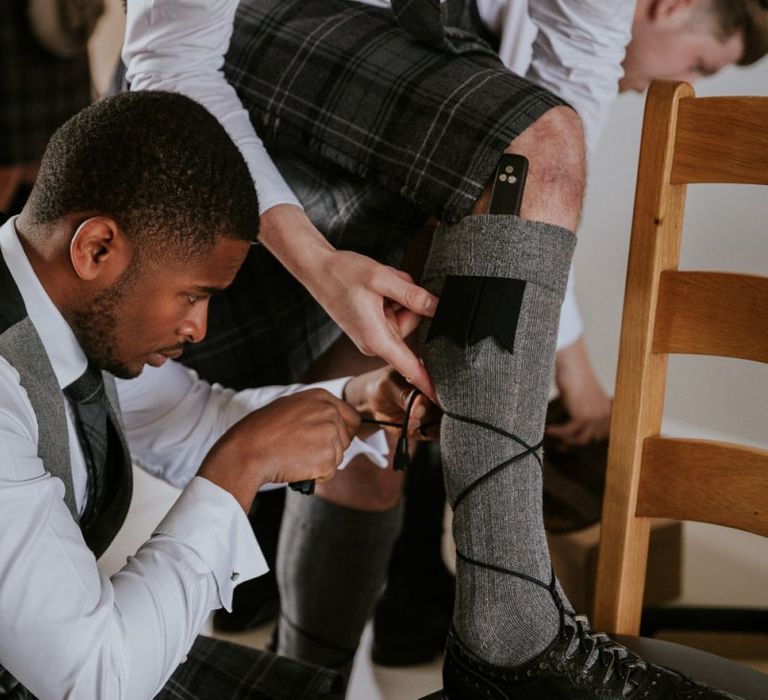 Groom gets into kilt for church wedding