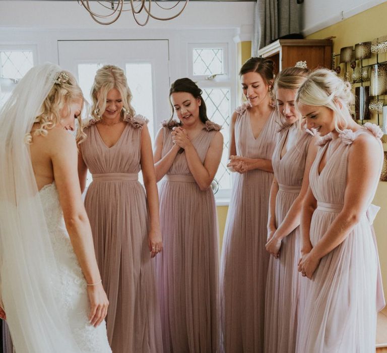 Pink bridesmaid dresses with Enzoani wedding dress