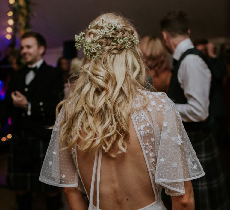 Bridal hair half up half down with flower hair piece