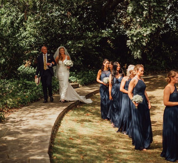 Navy bridesmaid dresses and lace bride dress for Micklefield Hall wedding