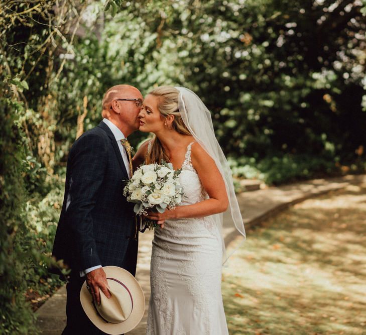 Bride kisses father at Altar before greeting wife-to-be