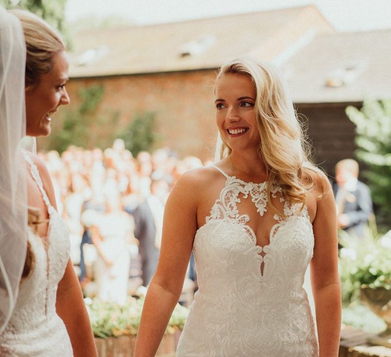 Bride in lace halter neck wedding dress