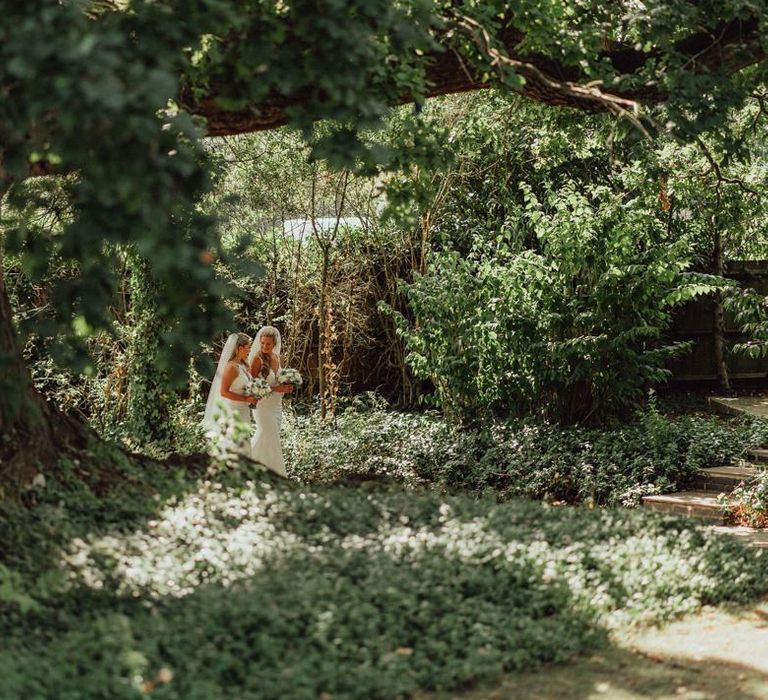 Brides take a stroll through Micklefield Hall wedding venue grounds