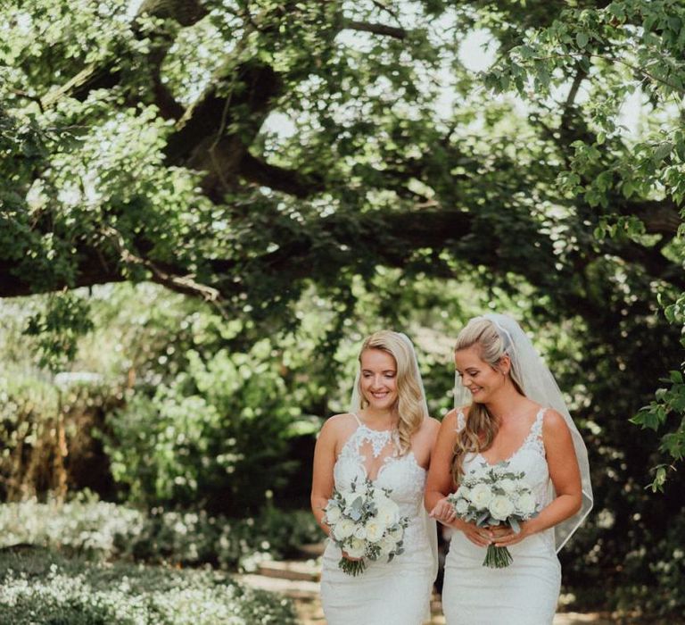 Brides take a stroll through Micklefield Hall wedding venue grounds