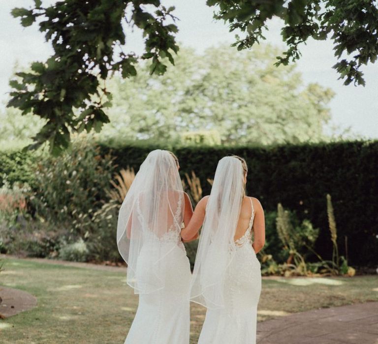 Low back lace wedding dress with veil for same-sex wedding