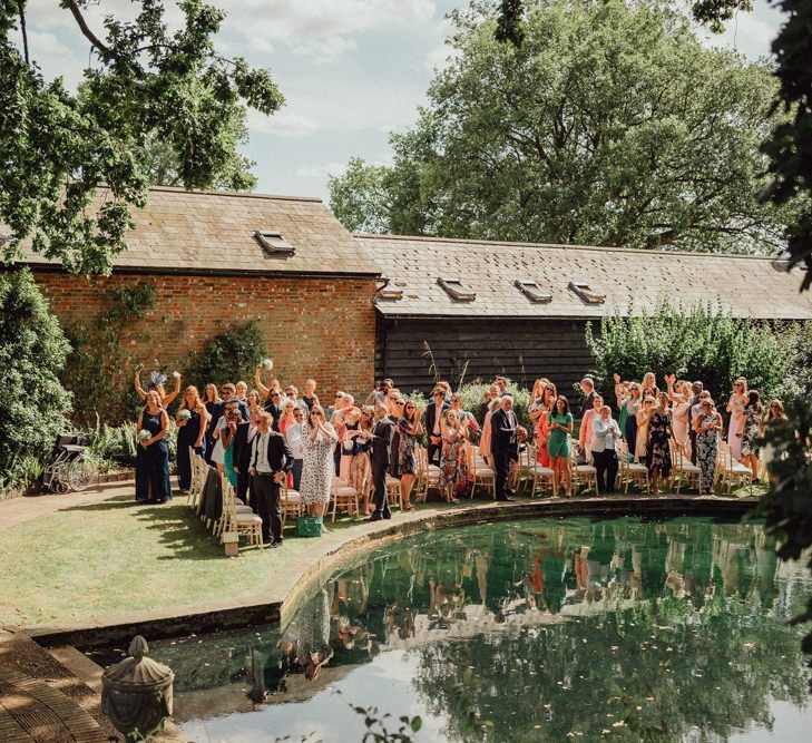 guests enjoy waterside wedding ceremony