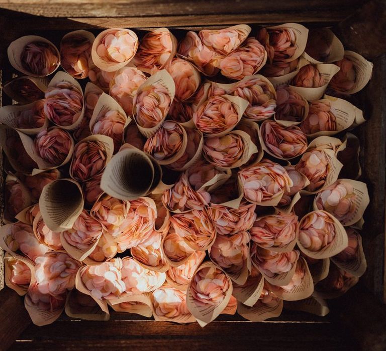 Pink flower petals in cones for confetti