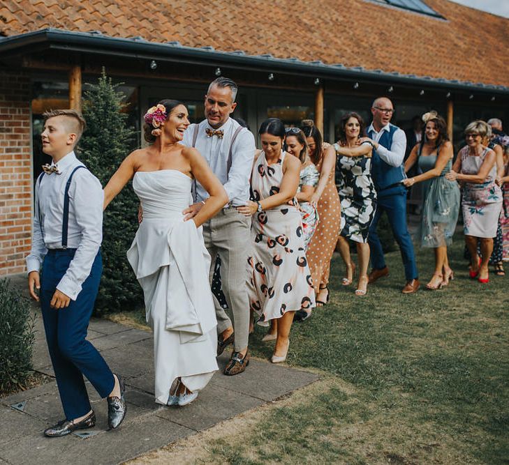 Wedding Party Conga // Vow Renewal At Doddington Hall With Bride In Alan Hannah With Brightly Coloured Florals And Images From Magda K Photography