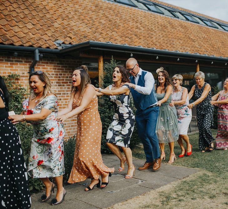 Wedding Party Conga // Vow Renewal At Doddington Hall With Bride In Alan Hannah With Brightly Coloured Florals And Images From Magda K Photography