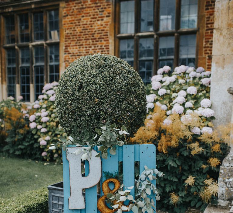 Wooden Palette Sign For Wedding // Vow Renewal At Doddington Hall With Bride In Alan Hannah With Brightly Coloured Florals And Images From Magda K Photography