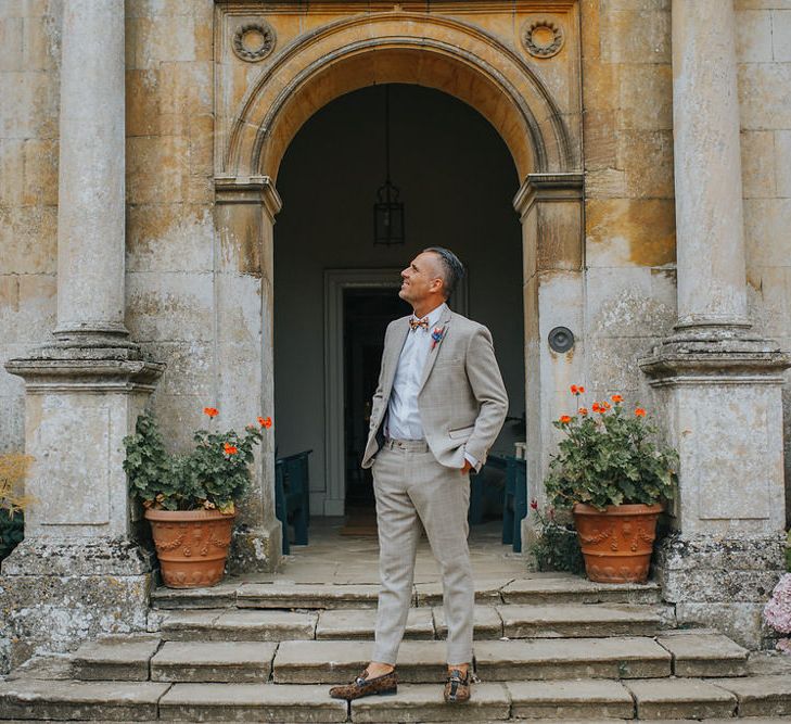 Groom In Light Grey Checked Suit // Vow Renewal At Doddington Hall With Bride In Alan Hannah With Brightly Coloured Florals And Images From Magda K Photography