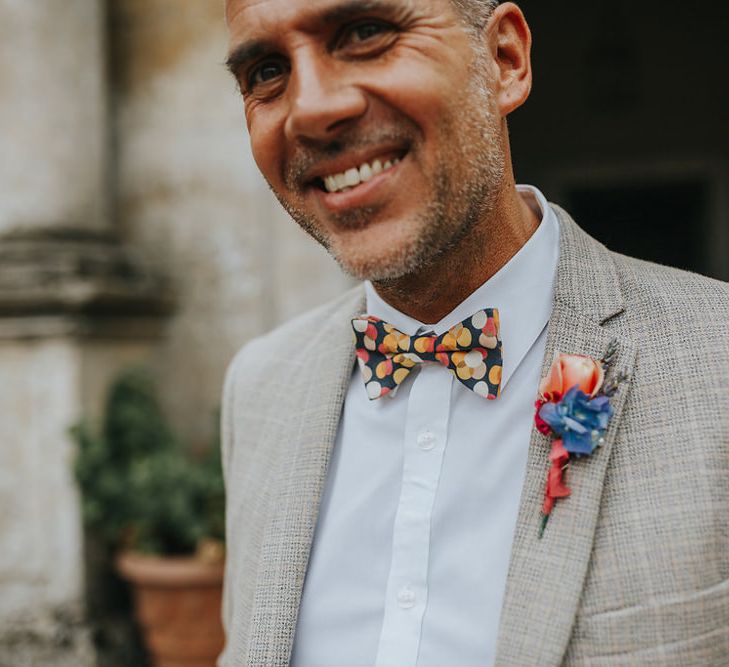 Groom In Light Grey Checked Suit // Vow Renewal At Doddington Hall With Bride In Alan Hannah With Brightly Coloured Florals And Images From Magda K Photography