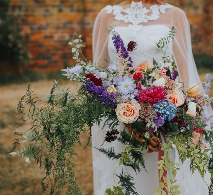 Oversized Wedding Bouquet // Vow Renewal At Doddington Hall With Bride In Alan Hannah With Brightly Coloured Florals And Images From Magda K Photography