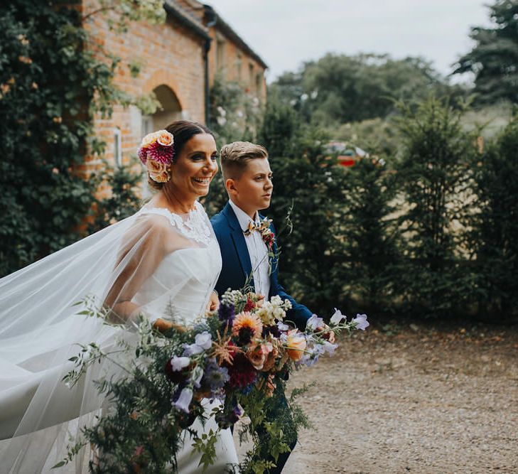 Bride In Alan Hannah With Oversized Wedding Bouquet // Vow Renewal At Doddington Hall With Bride In Alan Hannah With Brightly Coloured Florals And Images From Magda K Photography