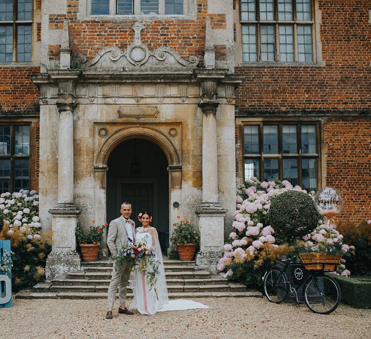 Vow Renewal At Doddington Hall With Bride In Alan Hannah With Brightly Coloured Florals And Images From Magda K Photography