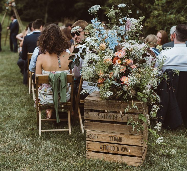 Pastel Pink, Blue, Peach Floral Arrangement on Wooden Crate