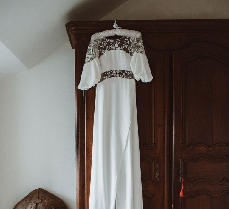 Rime Arodaky – Cooper Wedding Dress Hanging Up &amp; Blue Wedding Shoes