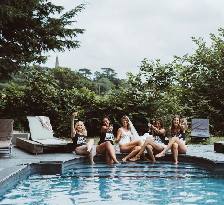 Bridal Party Hanging Out By The Pool in Bridal Squad Swimsuits