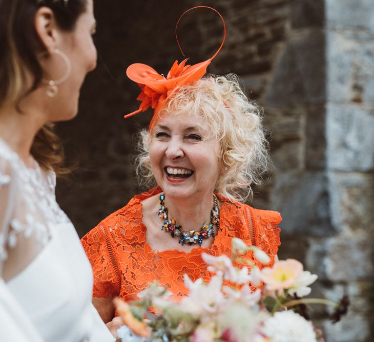 Wedding Guest Laughing with Bride