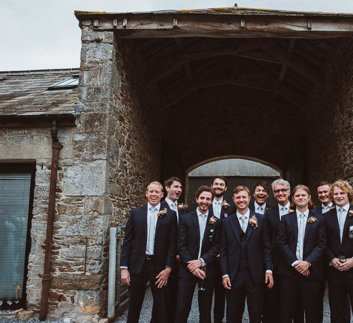 Groom in REISS suit and Groomsmen in Moss Bros. Suits