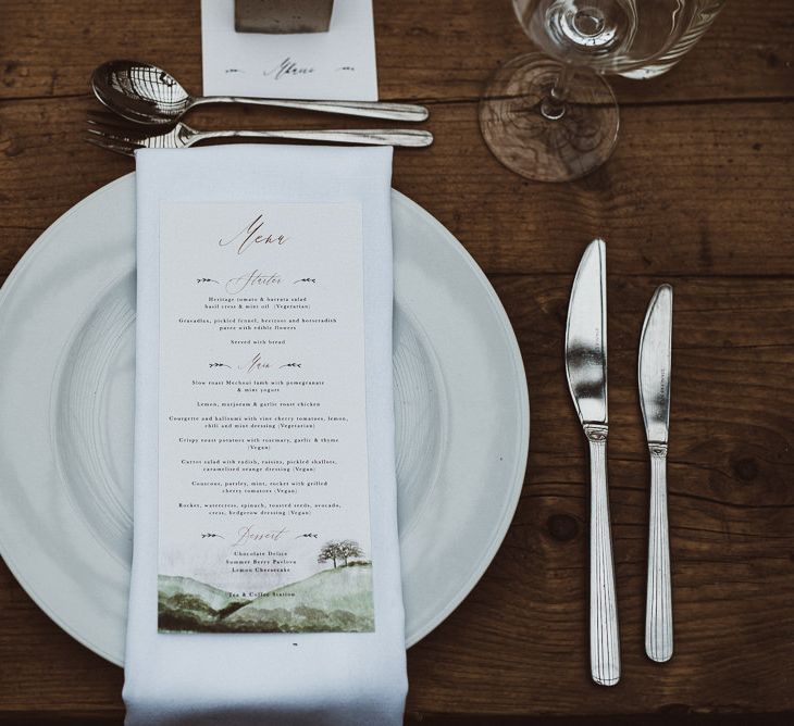 Place Setting with White Napkin and Menu Card