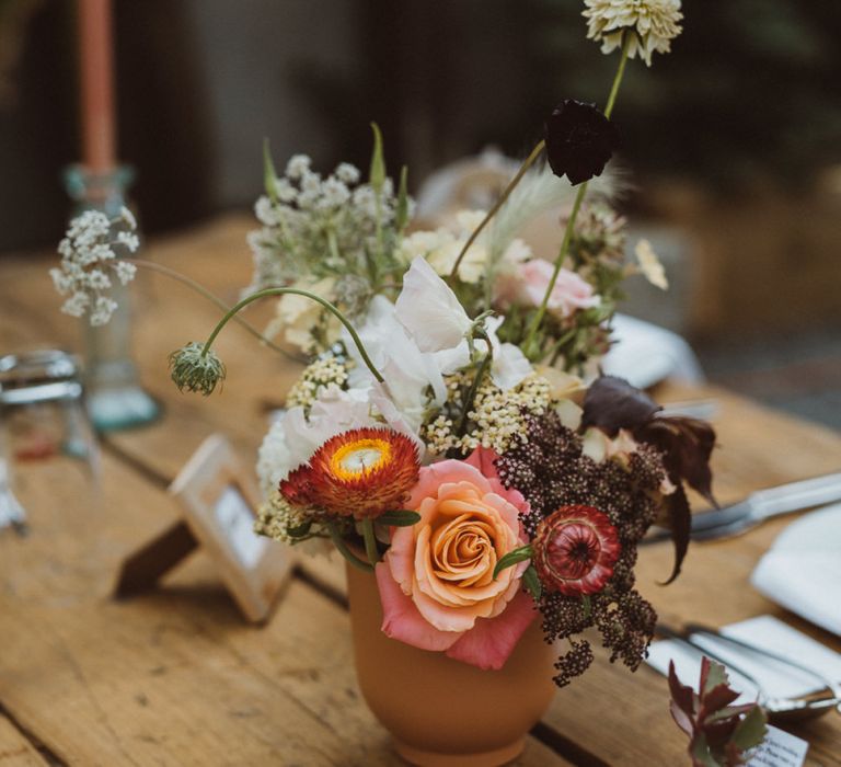 Centrepiece of Wild Wedding Flowers in Plant Pot