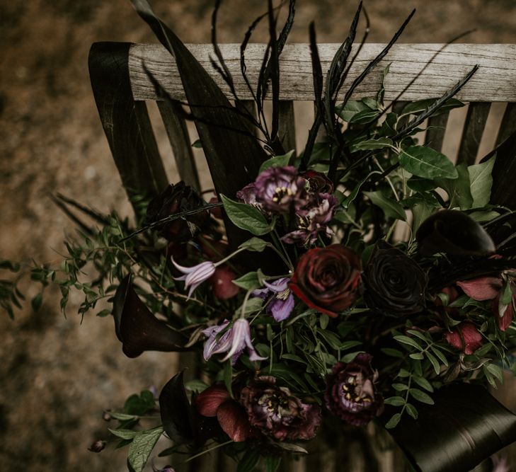 Deep Red, Plum &amp; Purple Wedding Bouquet Flowers | Forest Green and Black Dark Decadence Wedding Inspiration in a Rustic Barn Planned &amp; Styled by Knots &amp; Kisses with Images by Daze of Glory Photography