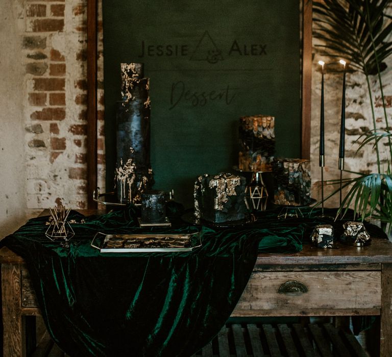 Cake Table with Velvet Drape &amp; Flag Backdrop Wedding Sign | Forest Green and Black Dark Decadence Wedding Inspiration in a Rustic Barn Planned &amp; Styled by Knots &amp; Kisses with Images by Daze of Glory Photography