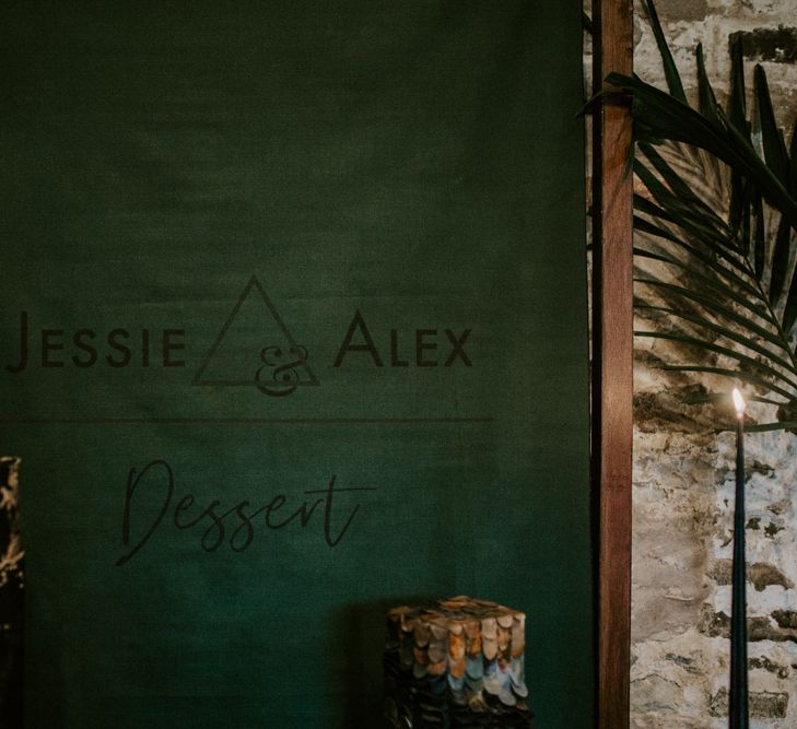 Forest Green Flag Backdrop with Geometric Design | Forest Green and Black Dark Decadence Wedding Inspiration in a Rustic Barn Planned &amp; Styled by Knots &amp; Kisses with Images by Daze of Glory Photography