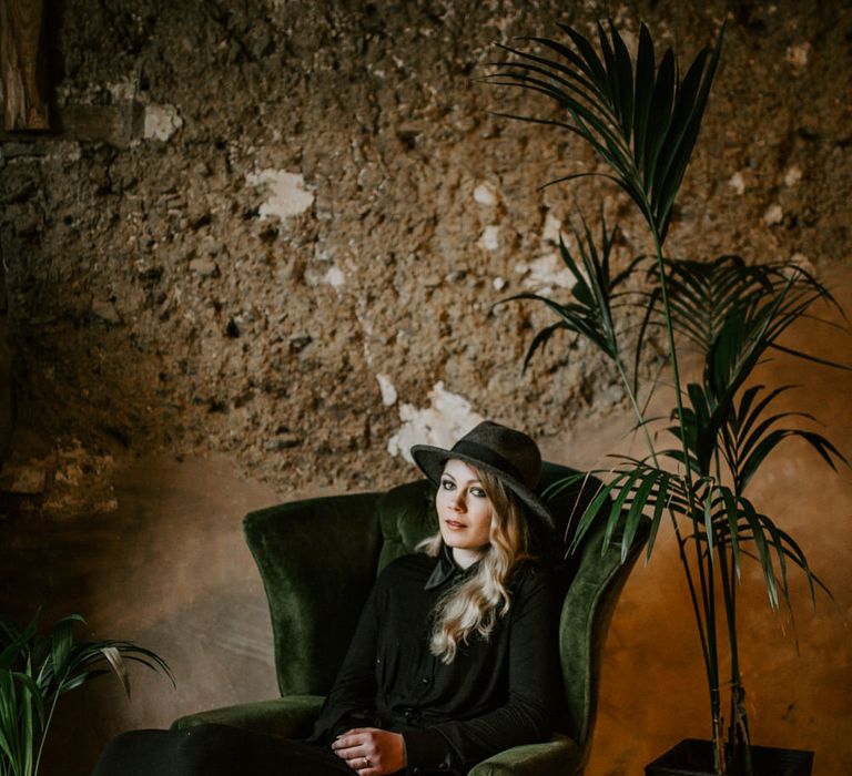 Bride in Black Wedding Dress &amp; Hat with Leather Jacket | Forest Green and Black Dark Decadence Wedding Inspiration in a Rustic Barn Planned &amp; Styled by Knots &amp; Kisses with Images by Daze of Glory Photography