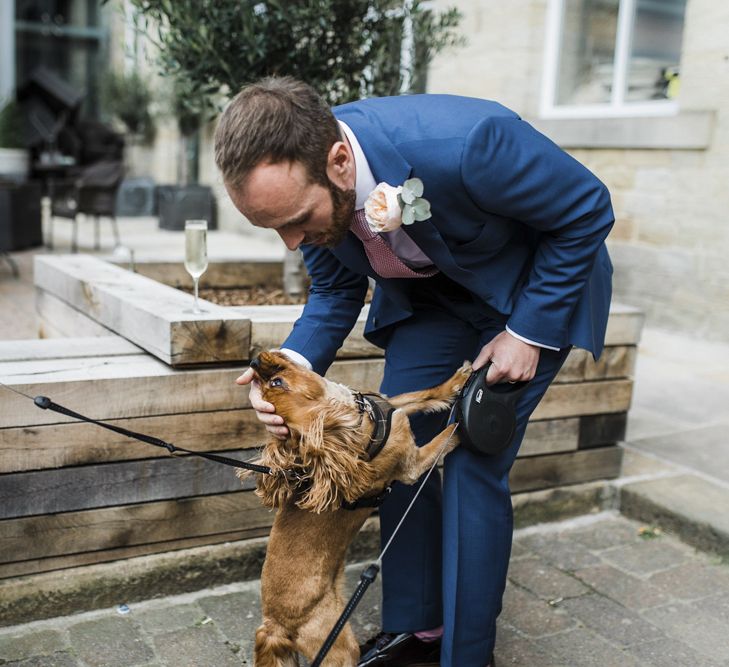 Groom in Navy Suit and Pet Dog