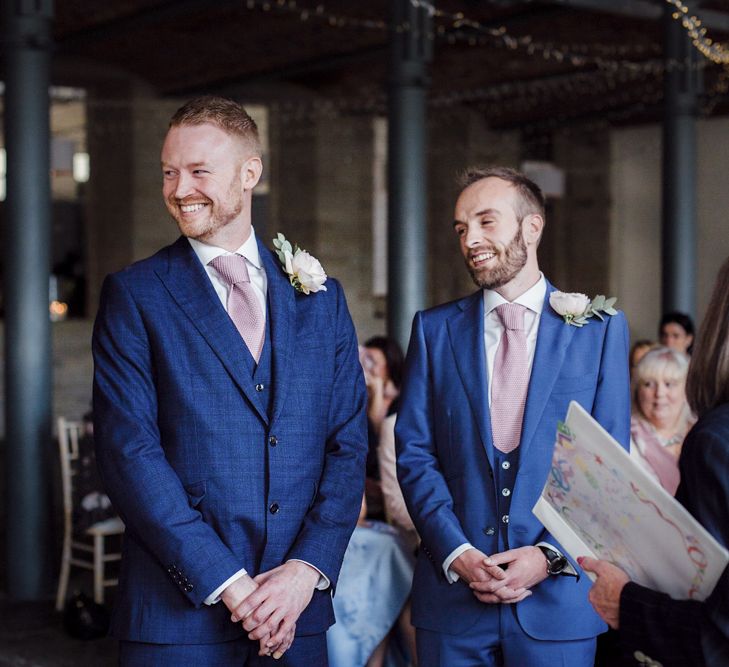 Wedding Ceremony with Two Grooms in Navy Blue Suits