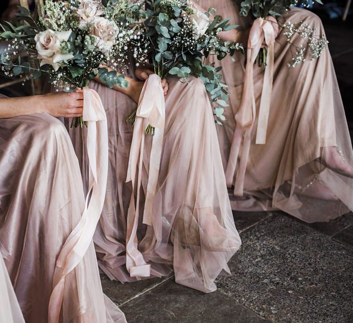 Bridesmaids in Blush Pink Sequins and Tulle Maya Dresses Sitting at the Wedding Ceremony