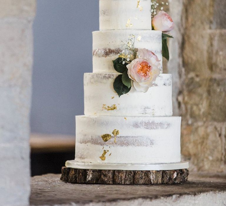 Five Tier Semi Naked Wedding Cake on Tree Slice Cake Stand