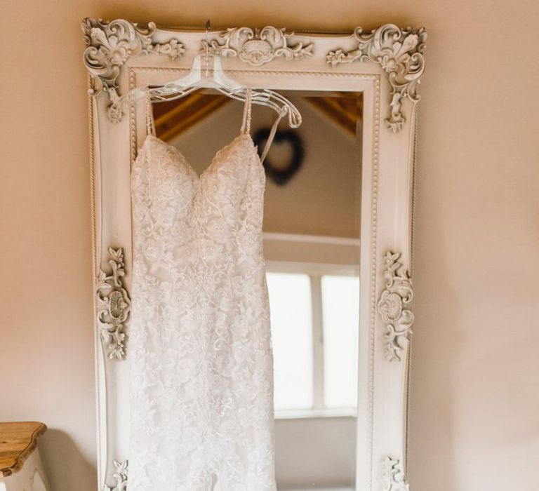 Lace brides dress for traditional celebration with gypsophila bouquets