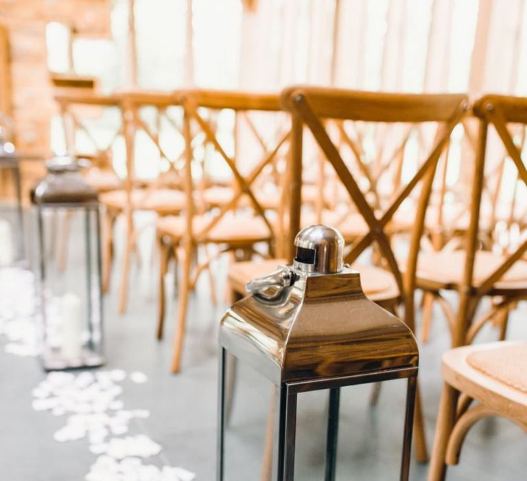 White petal and tall lantern aisle decoration