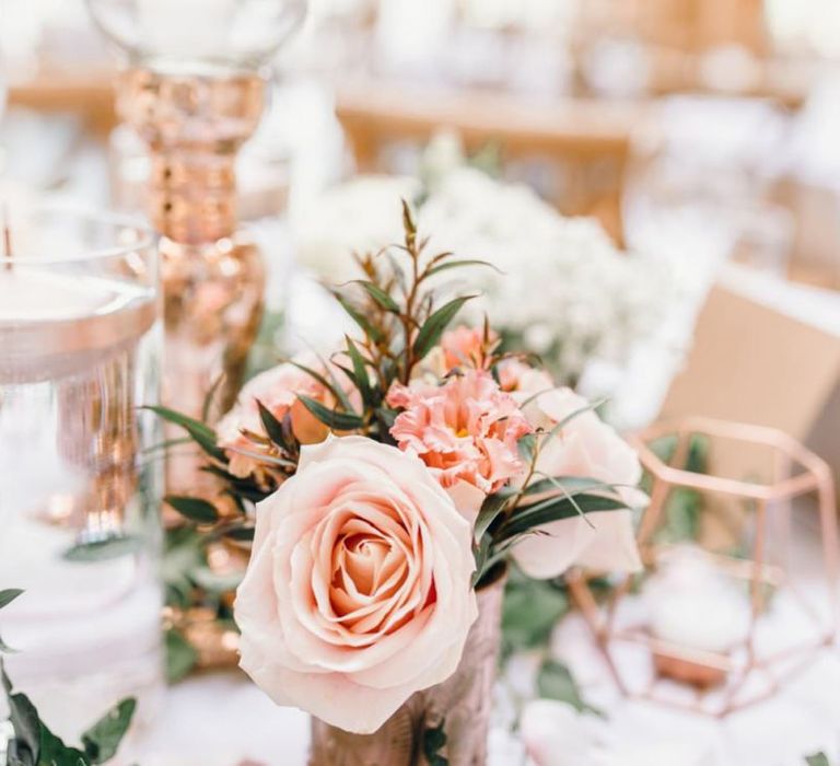 Pink roses for wedding reception centrepieces with rose gold detailing and gypsophila bouquets