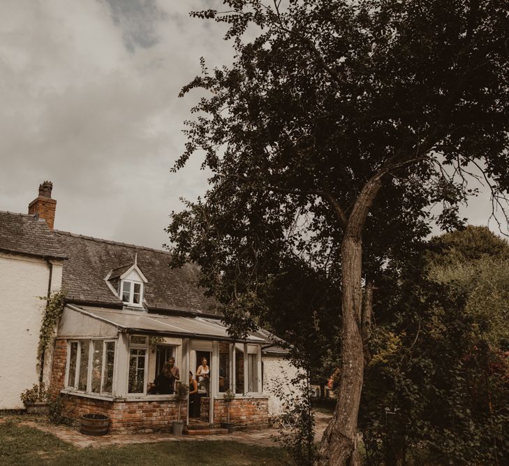 17th Century Farmhouse at Sychpwll Centre in Wales | Bridal Party Getting Ready | Yurt Wedding with Outdoor Naked Tipi Ceremony, Glitter Station &amp; Peach Rewritten Bridesmaid Dresses | Nesta Lloyd Photography