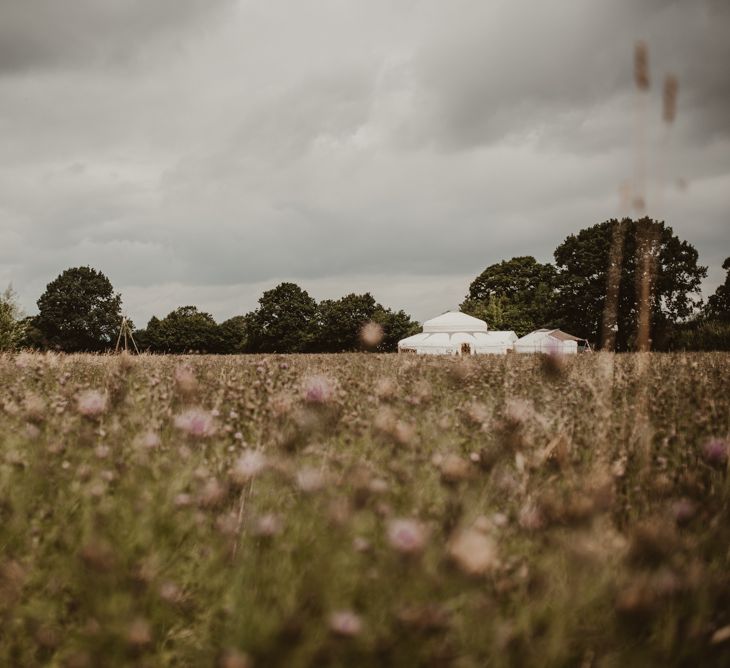 Wedding Yurt in 5 Acre Wildflower Meadow at Sychpwll Centre in Wales | Yurt Wedding with Outdoor Naked Tipi Ceremony, Glitter Station &amp; Peach Rewritten Bridesmaid Dresses | Nesta Lloyd Photography