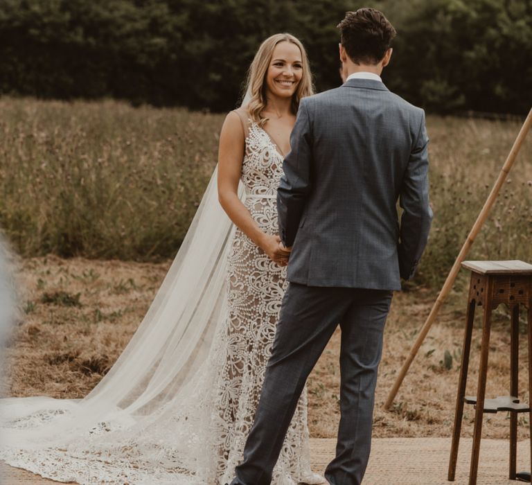 Bride in Sasha Dress by Made With Love with Crochet Finish, Fishtail Train, V-Neck and Plunging Back | Groom in Light Blue Two-Piece Suit by Hugo Boss | Yurt Wedding with Outdoor Naked Tipi Ceremony, Glitter Station &amp; Peach Rewritten Bridesmaid Dresses | Nesta Lloyd Photography