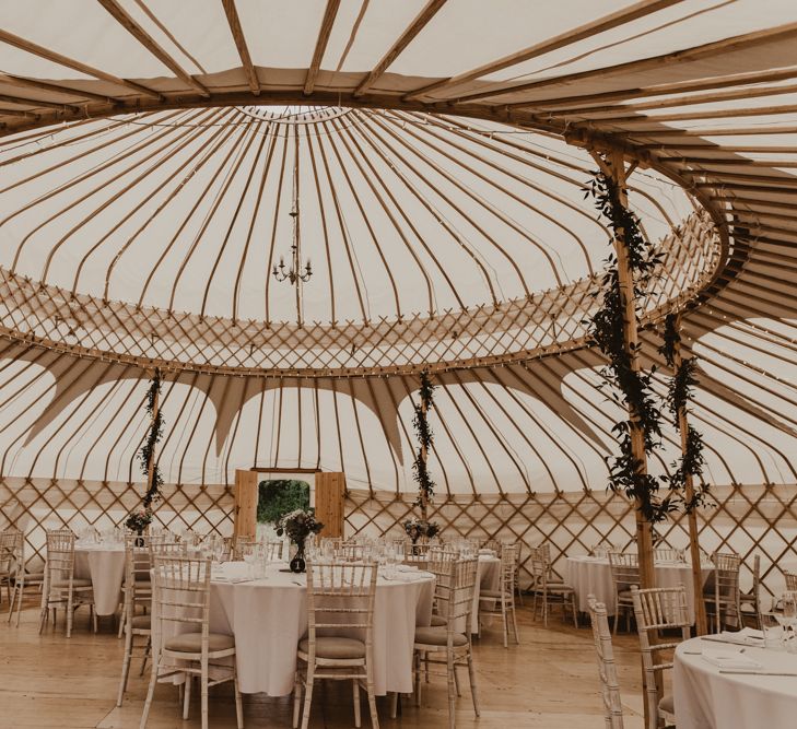 Yurt Wedding Reception at Sychpwll Centre in Wales | Foliage Wrapped Around Poles | Fairy Lights | Yurt Wedding with Outdoor Naked Tipi Ceremony, Glitter Station &amp; Peach Rewritten Bridesmaid Dresses | Nesta Lloyd Photography