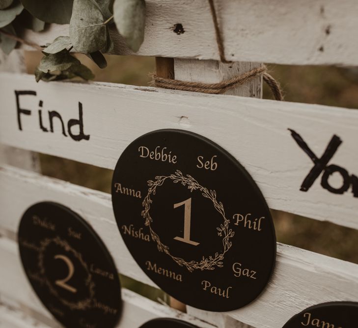 White Pallet Table Plan with Slate Coasters | Yurt Wedding with Outdoor Naked Tipi Ceremony, Glitter Station &amp; Peach Rewritten Bridesmaid Dresses | Nesta Lloyd Photography