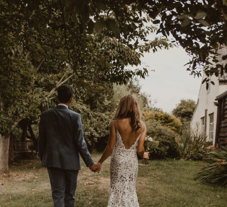 Bride in Sasha Dress by Made With Love with Crochet Finish, Fishtail Train, V-Neck and Plunging Back | Bridal Bouquet of Blush and White Roses, Gypsophila and Eucalyptus | Groom in Light Blue Two-Piece Suit by Hugo Boss | Yurt Wedding with Outdoor Naked Tipi Ceremony, Glitter Station &amp; Peach Rewritten Bridesmaid Dresses | Nesta Lloyd Photography