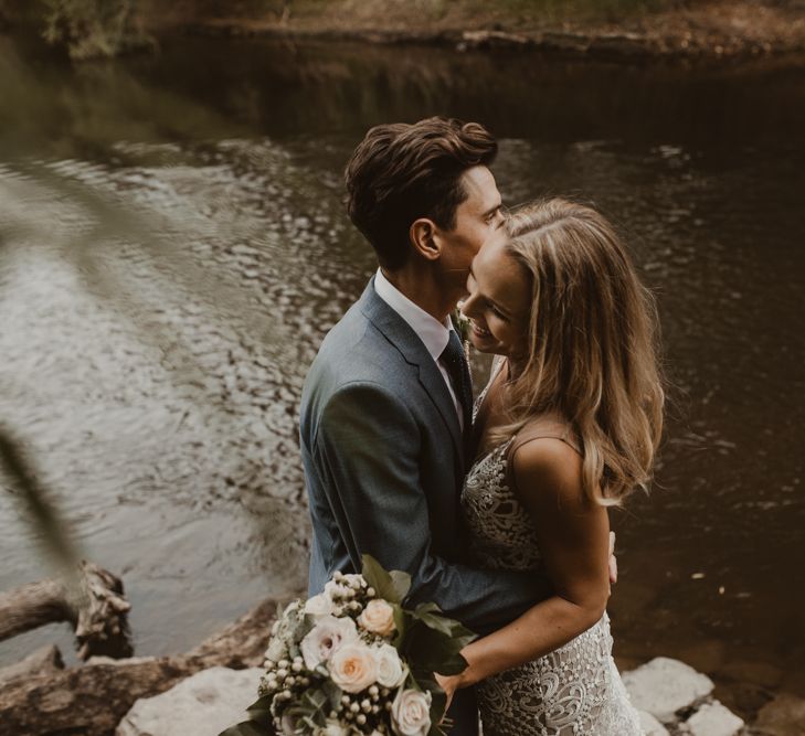 Bride in Sasha Dress by Made With Love with Crochet Finish, Fishtail Train, V-Neck and Plunging Back | Bridal Bouquet of Blush and White Roses, Gypsophila and Eucalyptus | Groom in Light Blue Two-Piece Suit by Hugo Boss | Yurt Wedding with Outdoor Naked Tipi Ceremony, Glitter Station &amp; Peach Rewritten Bridesmaid Dresses | Nesta Lloyd Photography